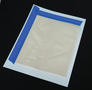Preparing fabric for printing on an ink jet printer