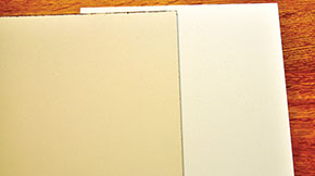 Wood panel on left has not been sealed prior to applying gesso, exhibiting Support Induced Discoloration. Panel on right has a sealing layer prior to applying final gesso layer.