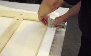 10. The canvas is secured with staples on the reverse.
