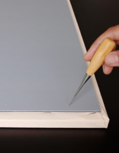 stitching awls to perforate backing boards before attaching with screws.