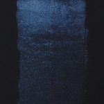QoR Interference Blue watercolor lightfast test result photograph of a 25 water to 1 paint dilution on cold pressed black watercolor paper.